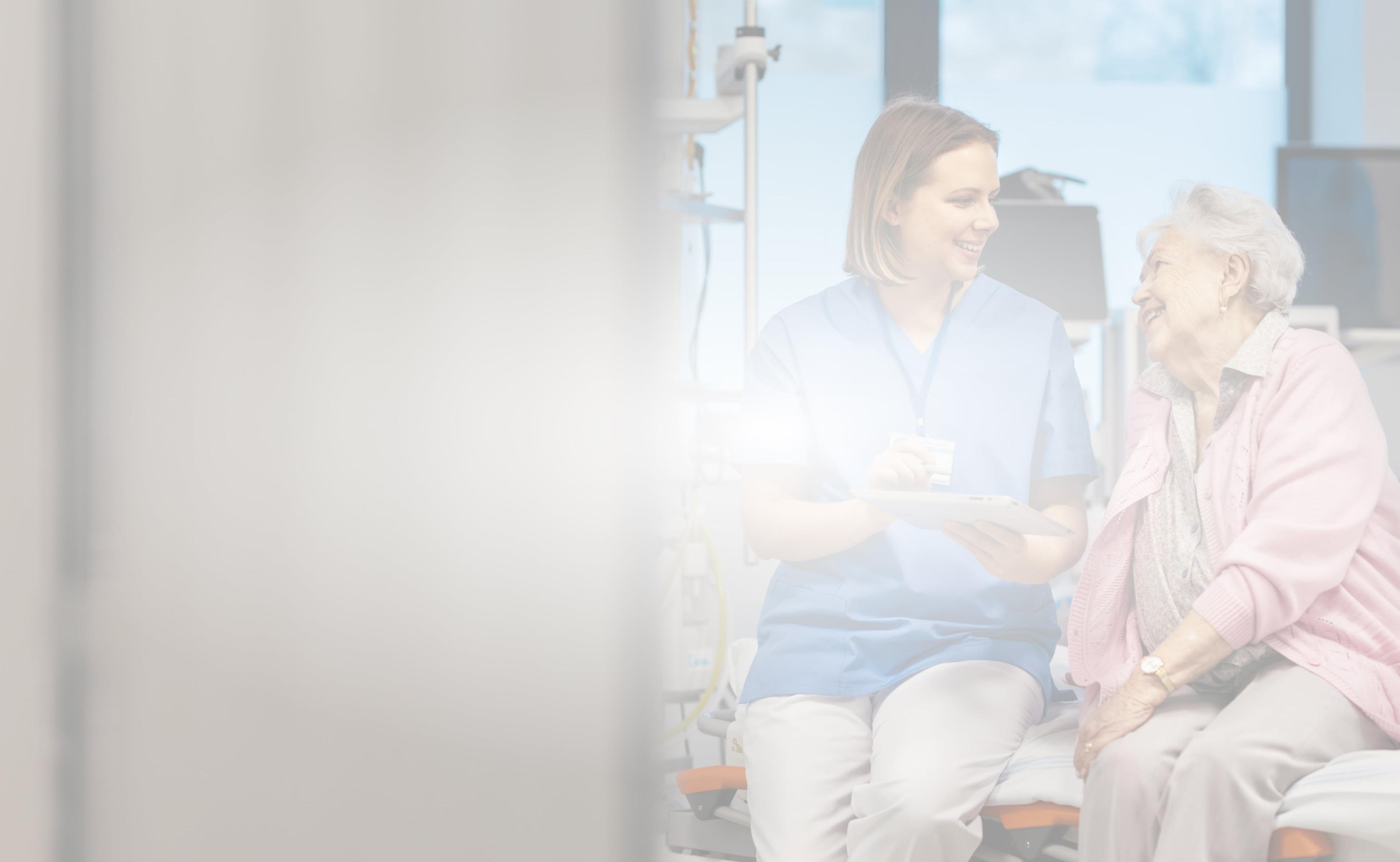 older woman talking to nurse